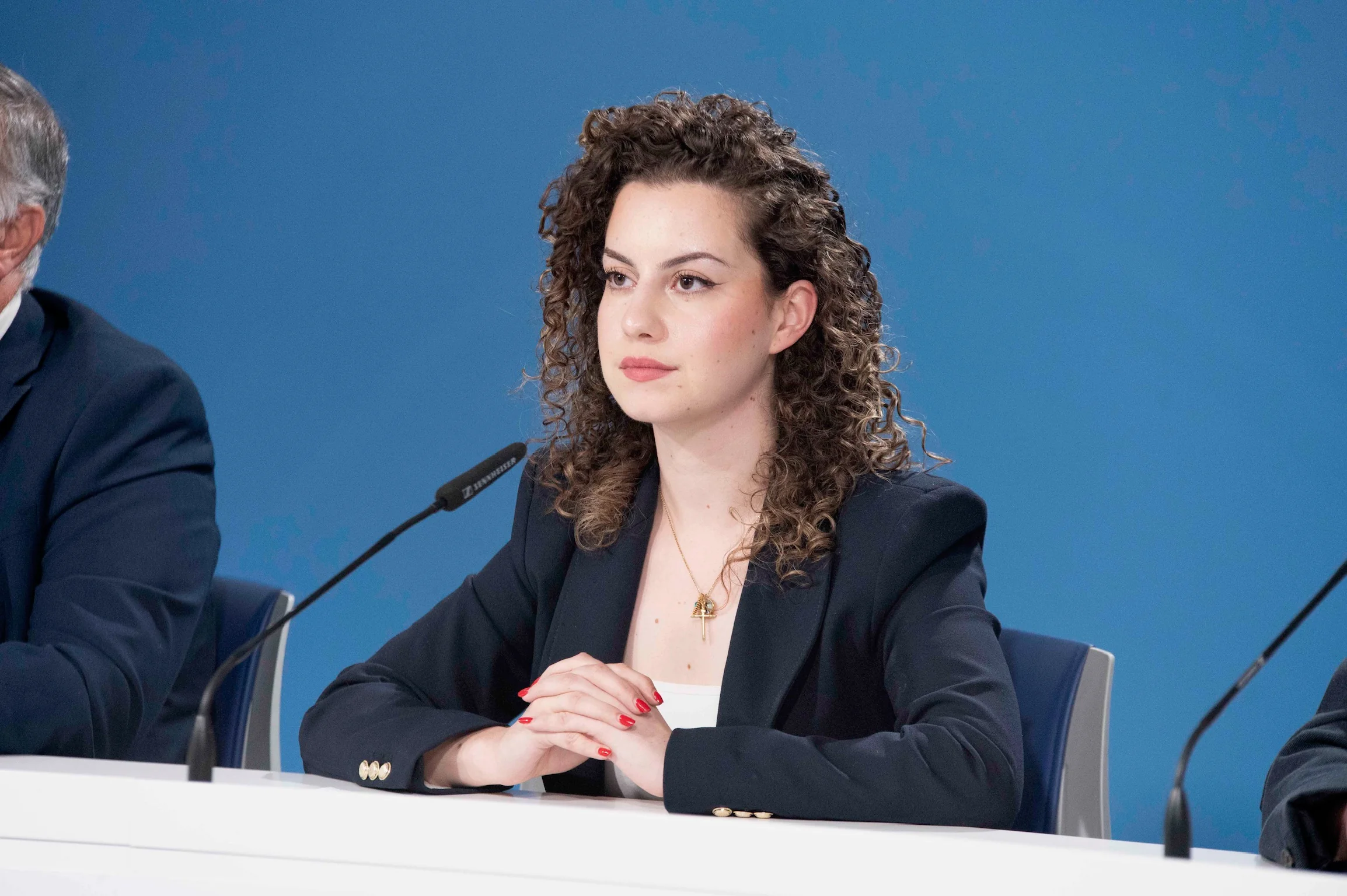 Eve Borg Bonello seated in parliament chamber during legislative session
